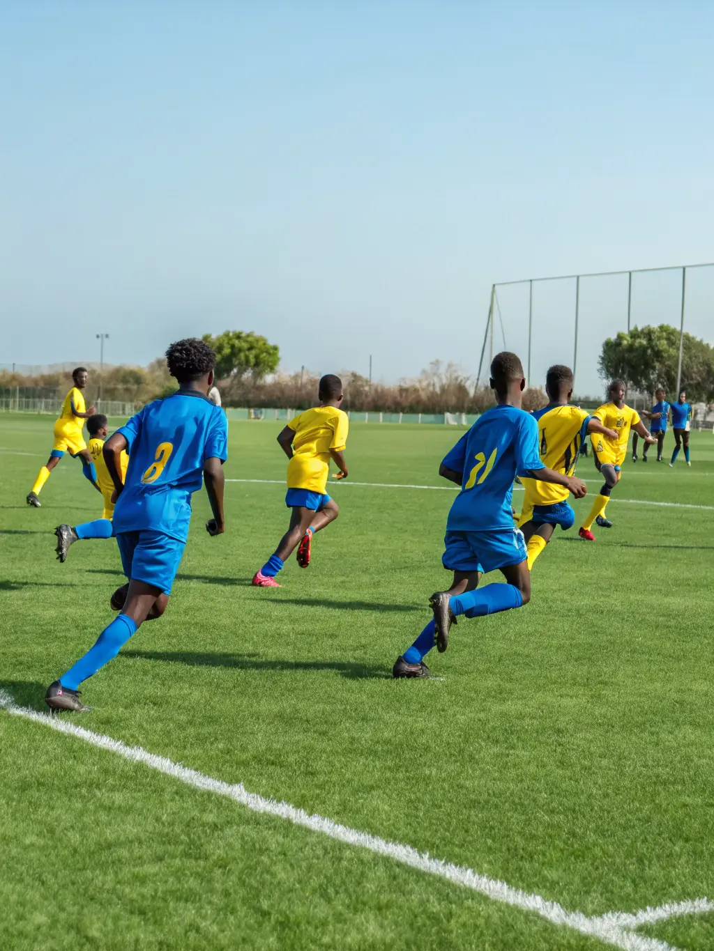 An action shot of a sports team playing a game, emphasizing teamwork and physical activity, with the ASSOC CULTURELLE ARTISTIQUE ET SPORTIVE logo subtly visible in the background.